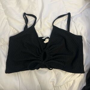Women’s black crop top with opening on the front. H&M; size medium.